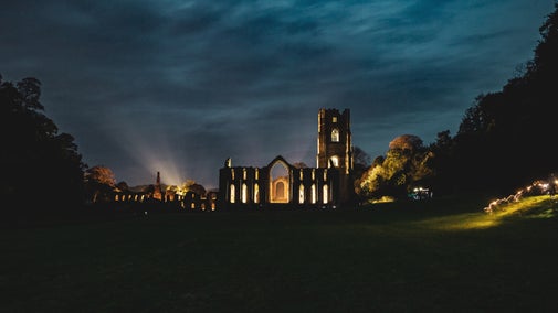 Fountains Abbey is aglow with lights from the East Green